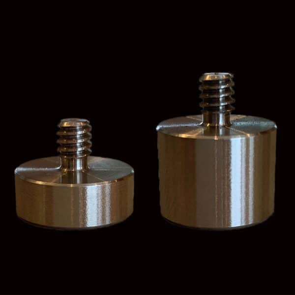 two metal screws on a black background